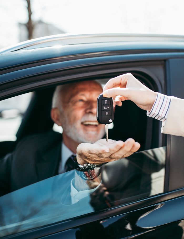A dealer handing over the keys